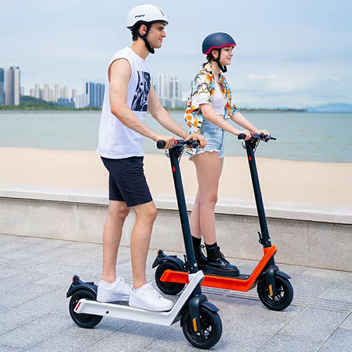 2 people riding the 850 watt pro electric scooter